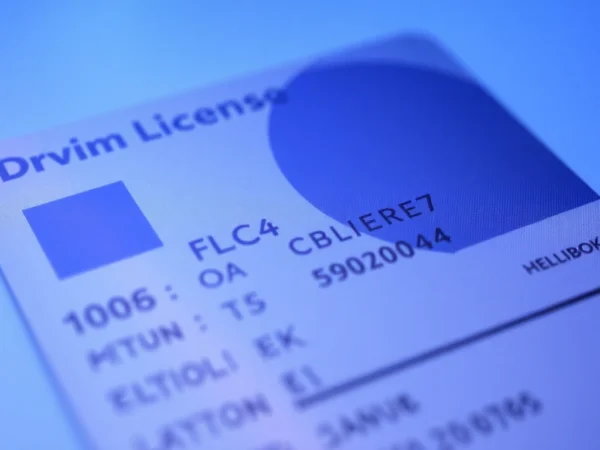 Buy UK driving licence without test highlighted on a secure-looking license with holographic security features for easy recognition.